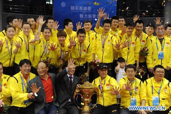 Team members of China react during the awarding ceremony of the 2011 Sudirman Cup in Qingdao, east China's Shandong Province, May 29, 2011. China claimed the champion. (Xinhua/Li Ziheng) 