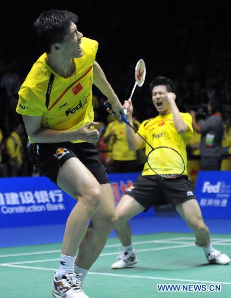 Cai Yun and Fu Haifeng (L) of China celebrate for victory during the men's doubles match against Carsten Mogensen and Jonas Rasmussen of Denmark during the final of the 2011 Sudirman Cup between the two teams in Qingdao, east China's Shandong Province, May 29, 2011. Cai and Fu won 2-0 and China claimed the champion with 3-0. (Xinhua/Zhu Zheng)