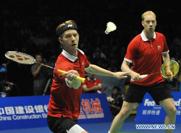 Carsten Mogensen and Jonas Rasmussen of Denmark compete during the men's doubles match against Cai Yun and Fu Haifeng of China during the final of the 2011 Sudirman Cup between the two teams in Qingdao, east China's Shandong Province, May 29, 2011. Carsten Mogensen and Jonas Rasmussen lost 0-2 and Denmark lost 0-3 to take the 2nd place. (Xinhua/Zhu Zheng) 