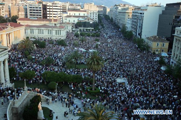 Greek protesters hold a demonstration in front of the old university in Athens, Greece, on May 31, 2011. The protest was organized by Greek academics against austerity measures and was joined by thousands of Greek citizens. [Xinhua]