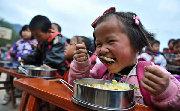 A student enjoys a free lunch at school.