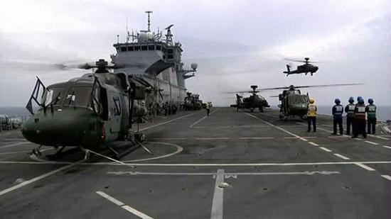 This image taken from video and made available by the British Ministry of Defense shows British Apache helicopters on deck of the HMS Ocean in the Mediterranean Sea, off Libya on Saturday June 4, 2011. [CNTV]