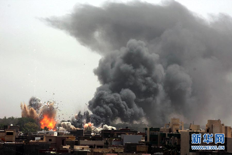 Huge explosions have rocked the Libyan capital, Tripoli, during a series of air strikes by low-flying Nato jets on June 7, 2011. Low-flying Nato planes pounded Tripoli in a series of 26 strikes that shook the Libyan capital in rare daytime raids designed to step up pressure on Muammar Gaddafi to leave power. [Photo/Xinhua]
