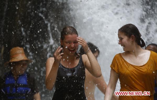 Hikers play at Jordan's Wadi Al Mujib natural reserve, which is also called the Grand Canyon of Jordan, 40km south of Jordan's capital Amman, on June 7, 2011. [Xinhua/Mohammad Abu Ghosh] 