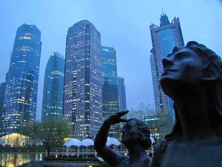 Statues look out over the soaring skyline of Lujiazui, Shanghai's trade and finance zone. Home to 51 skyscrapers, the city has the second largest number of tall towers after Hong Kong in China.