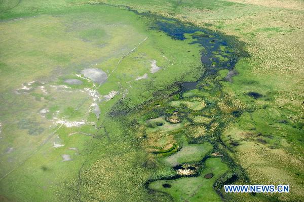 Photo taken on June 9, 2011 shows a bird's-eye view of the Hulun Buir Grassland in Hulun Buir, north China's Inner Mongolia Autonomous Region. [Xinhua/Zhang Ling]