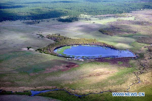 Photo taken on June 9, 2011 shows a bird's-eye view of the Hulun Buir Grassland in Hulun Buir, north China's Inner Mongolia Autonomous Region. [Xinhua/Zhang Ling]