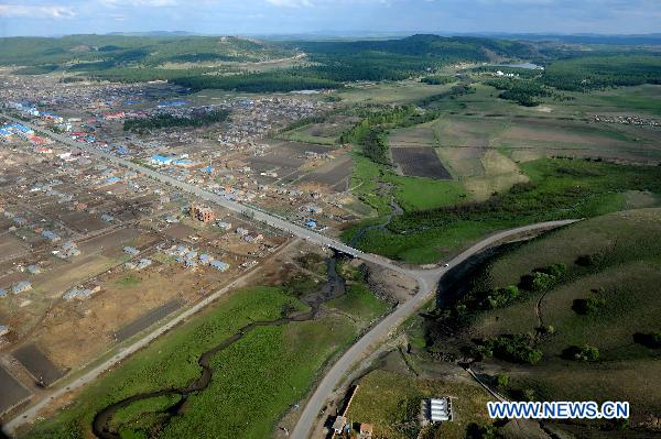 Photo taken on June 9, 2011 shows a bird's-eye view of the Hulun Buir Grassland and nearby forests in Hulun Buir, north China's Inner Mongolia Autonomous Region. [Xinhua/Zhang Ling] 