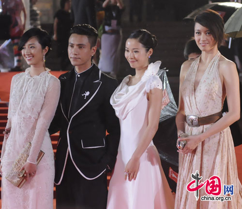 Cast members of the Chinese movie 'Rest On Your Shoulder' walk the red carpet at the opening ceremony of the 14th Shanghai International Film Festival at Shanghai Grand Theater on rainy Saturday. [Pang Li/China.org.cn] 