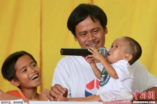 A Filipino blacksmith's son, who stands less than two-thirds of a meter tall, has been declared the world's shortest man. Sunday's announcement came on his 18th birthday, sparking celebrations across his hometown.