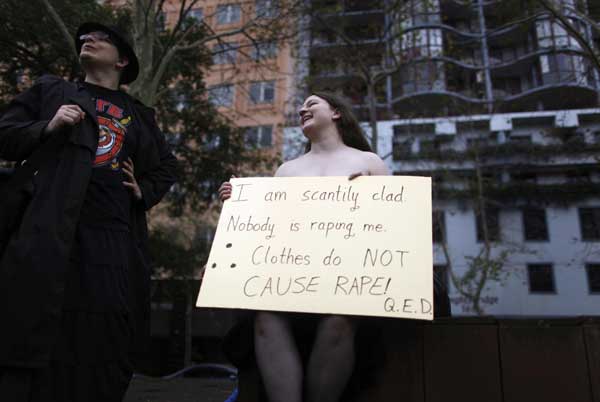 A protester holds a sign during a Slutwalk rally in Sydney June 13, 2011. About 1,000 people participated in the SlutWalk, a series of rallies in cities aorund the globe organised after the remarks by a Canadian police officer, who advised women &apos;to avoid dressing as sluts&apos;, if they did not want to be harassed, sparked a worldwide protest movement. [China Daily/Agencies]