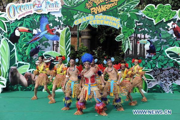 Dancers perform at the opening ceremony of the 'Rainforest', a theme zone in the Ocean Park in Hong Kong, south China, June 14, 2011. There are over 70 kinds of animals from tropical rain forests in the theme zone opened here on Tuesday. [Xinhua/Song Zhenping]