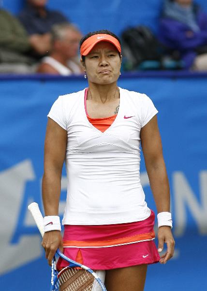 Li Na of China reacts during her second-round match against Daniela Hantuchova of Slovakia in 2011's AEGON International in Eastbourne, Britain, June 15, 2011. Li Na lost 0-2 (Xinhua/Chen Hongbo)