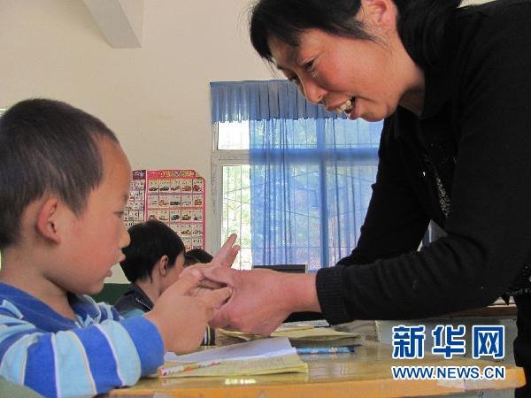 Zou Guifen now teaches all 16 students at the school. 