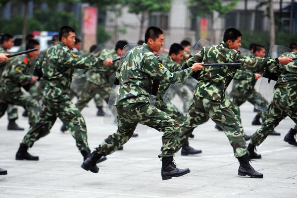 Chinese armed police display their combat skills during an anti-terrorism demonstration in Beijing to celebrate the 90th anniversary of Communist Party of China in June 16, 2011. [Photo/CFP]