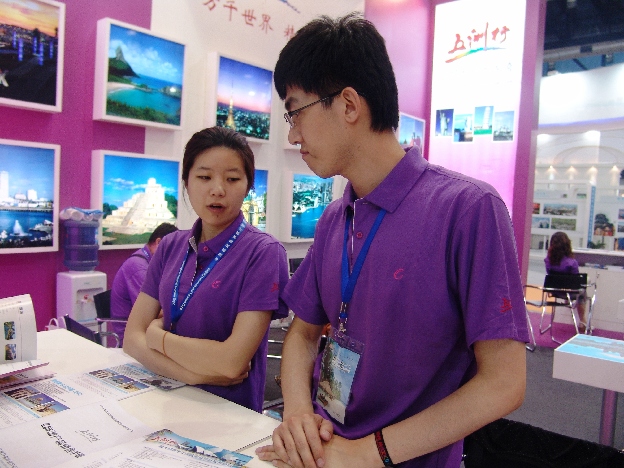 Global picture—Workers at Beijing Global Tour International Travel Service Co., Ltd, wait for potential customers to visit. 