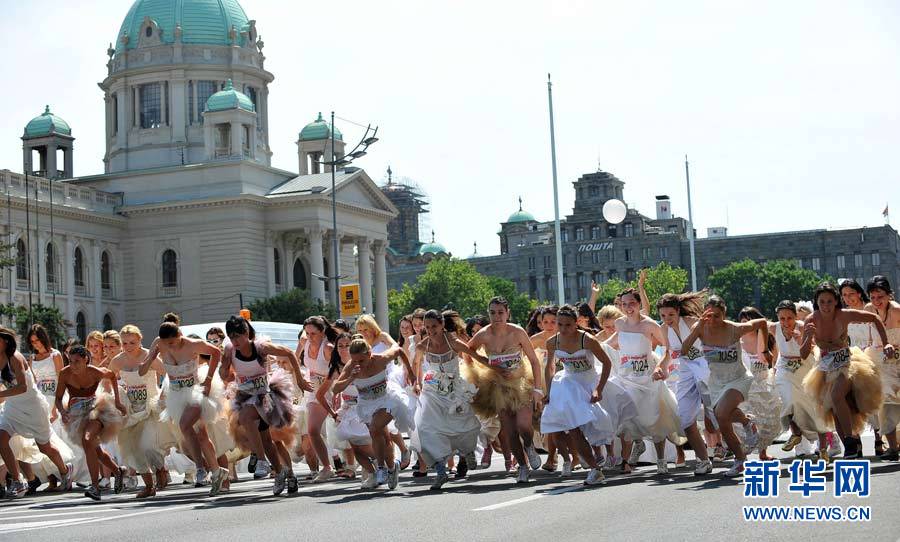 Brides compete in a race in central Belgrade, Serbia, on Sunday. About 50 women participated in the annual bridal race.