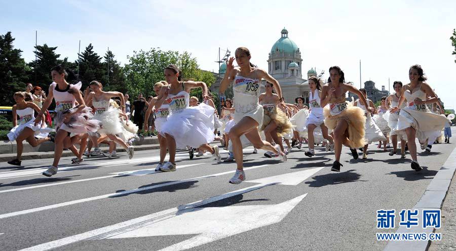 Brides compete in a race in central Belgrade, Serbia, on Sunday. About 50 women participated in the annual bridal race. 