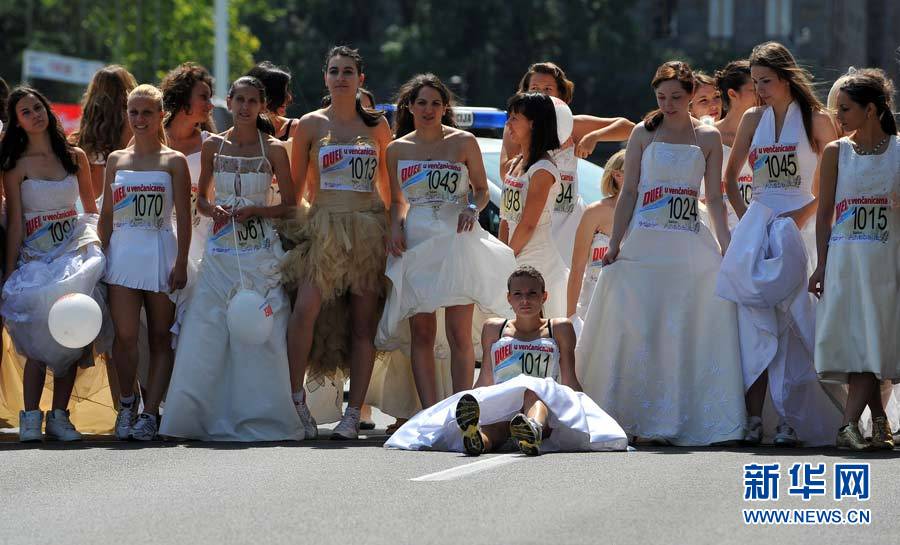 Brides compete in a race in central Belgrade, Serbia, on Sunday. About 50 women participated in the annual bridal race. 