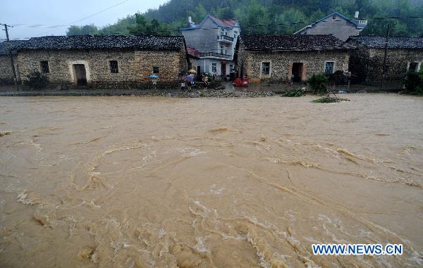 Photo taken on June 19, 2011 shows the inundated Longtoushan Town in Dexing City, east China's Jiangxi Province.