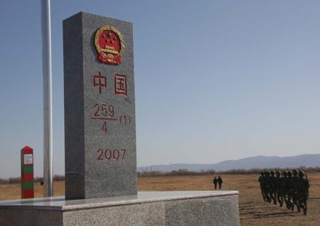 Chinese soldiers begin border patrol near the newly unveiled boundary marker for eastern section of China-Russia border at Heixiazi Island, October 14, 2008.