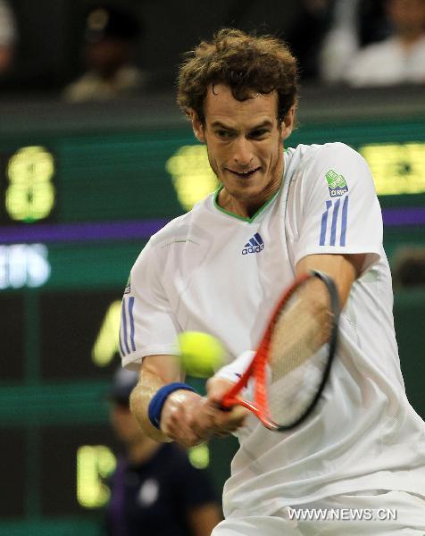 Andy Murray of Britain returns the ball during his first round match against Daniel Gimeno-Traver of Spain at the 2011 Wimbledon tennis Championships in London, Britain, June 20, 2011. Andy Murray won 3-1. (Xinhua/Tang Shi) 