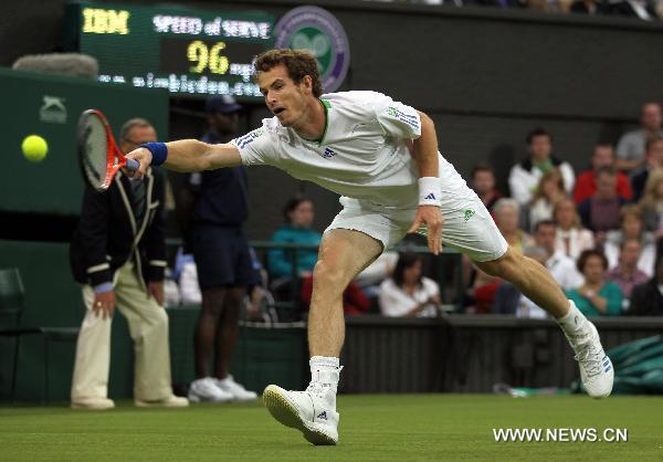 Andy Murray of Britain returns the ball during his first round match against Daniel Gimeno-Traver of Spain at the 2011 Wimbledon tennis Championships in London, Britain, June 20, 2011. Andy Murray won 3-1. (Xinhua/Tang Shi) 