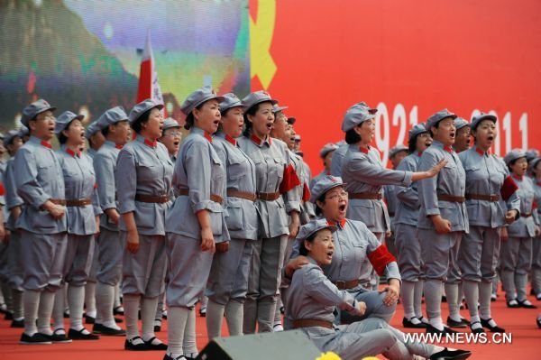 Choruses perform on stage during a songfest to celebrate the 90th anniversary of the founding of the Communist Party of China (CPC) in Wuxiang, north China's Shanxi Province, June 20, 2011. (Xinhua/Fan Minda) (dy) 