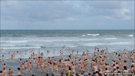 Almost 400 skinny dippers rushed into the sea at Rhossili on Gower on Sunday morning.