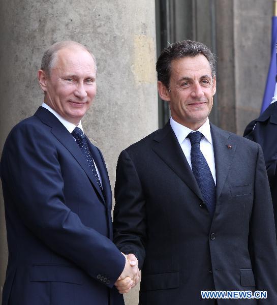 French President Nicolas Sarkozy (R) meets with visiting Russian Prime Minister Vladimir Putin at the Elysee Palace in Paris, France, June 21, 2011. [Gao Jing/Xinhua]