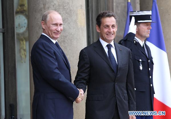 French President Nicolas Sarkozy (R Front) meets with visiting Russian Prime Minister Vladimir Putin at the Elysee Palace in Paris, France, June 21, 2011. [Gao Jing/Xinhua]