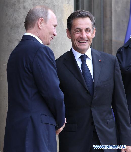 French President Nicolas Sarkozy (R) meets with visiting Russian Prime Minister Vladimir Putin at the Elysee Palace in Paris, France, June 21, 2011. [Gao Jing/Xinhua]