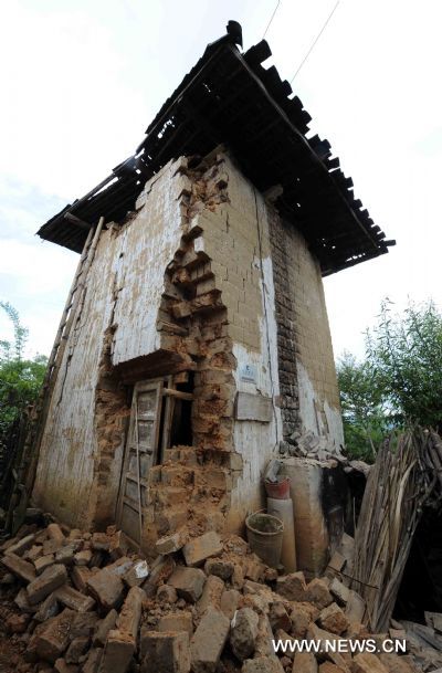 Photo taken on June 21, 2011 shows the house remains after an earthquake in Tengchong County, southwest China's Yunnan Province. The 5.2-magnitude earthquake that hit Tengchong on Monday has left six people injured and caused significant economic losses, the Ministry of Civil Affairs said Tuesday. As of 3 p.m. Tuesday, the quake had affected 22,000 local residents and led to the emergency relocation of 2,168 people. The local government has allocated 7 million yuan to set up a disaster relief fund, as well as sent hundreds of tents, quilts and articles of clothing to the quake zone, according to the ministry. (Xinhua/Yang Zongyou) (hdt) 