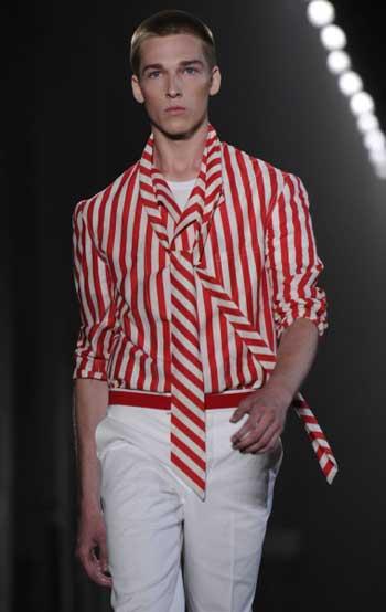 A model displays a creation as part of the Alexander McQueen spring-summer 2012 men's wear collection on June 20, 2011 during the men's fashion week in Milan.