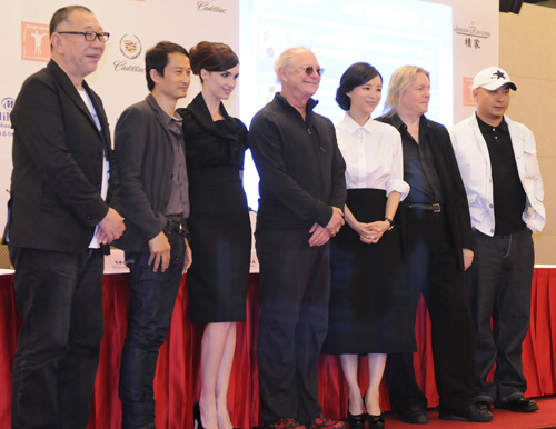 All the jury members of the 14th Shanghai International Film Festival meet the press in Shanghai on June 11, 2011. 