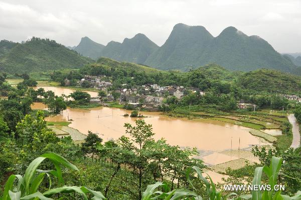 Photo taken on June 23, 2011 shows flooded farm in Jingnan Township of Xingyi, southwest China's Guizhou Province. 