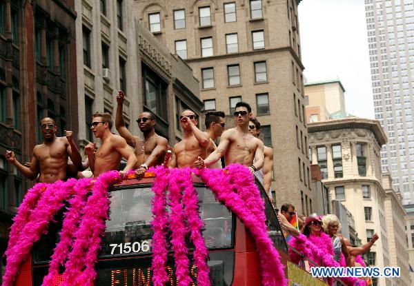 Participants take part in the NYC Gay Pride Parade along the Fifth Avenue in Manhattan, New York City, June 26, 2011. New York State lawmakers voted late Friday to legalize same-sex marriage, making New York the sixth and most populous U.S. state to allow gay marriage.[Wu Jingdan/Xinhua]