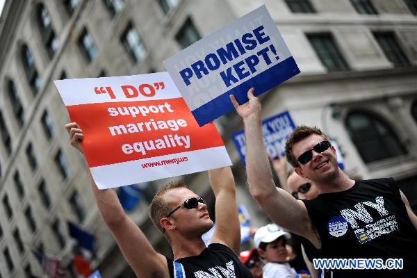 Participants take part in the NYC Gay Pride Parade along the Fifth Avenue in Manhattan, New York City, June 26, 2011. New York State lawmakers voted late Friday to legalize same-sex marriage, making New York the sixth and most populous U.S. state to allow gay marriage.[Shen Hong/Xinhua]