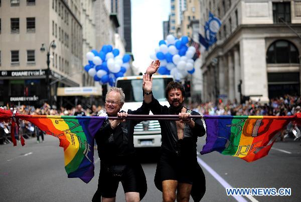 Participants take part in the NYC Gay Pride Parade along the Fifth Avenue in Manhattan, New York City, June 26, 2011. New York State lawmakers voted late Friday to legalize same-sex marriage, making New York the sixth and most populous U.S. state to allow gay marriage.[Shen Hong/Xinhua]