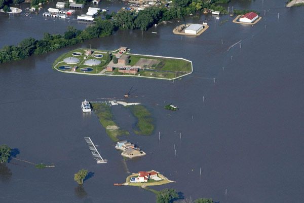 Large homes, a waste-water treatment plant and other businesses are cut off from the rest of Plattsmouth, Nebraska by Missouri River flood waters June 24, 2011. 