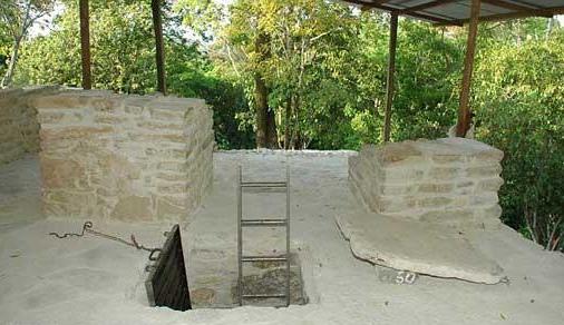 The entrance to the tomb. Inside, its floor occupies about five square metres with a low, Mayan-arch roof of overlapping stones.