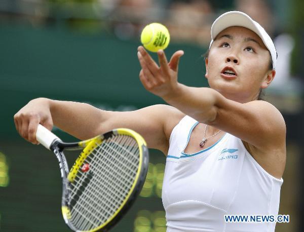 Peng Shuai of China serves during her third round match of women's singles against Melinda Czink of Hungary in 2011 Wimbledon Tennis Championships in London, Britain, June 25, 2011. Peng won 2-0. 