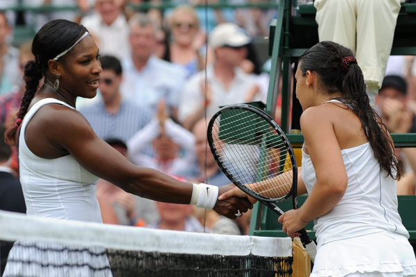 Serena Williams congratulates Marion Bartoli at the net after falling to a straight-sets defeat at the hands of the French Wimbledon 2007 finalist.