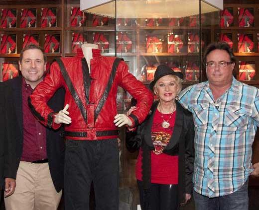 President and CEO of Juliens Auctions Beverly Hills Darren Julien, actress Tippi Hedren, a supporter of The Shambala Preserve where entertainer Michael Jackson's Bengal tigers now reside, and Milton Verret (L-R) of Austin, Texas, buyer of the jacket Jackson wore in his 'Thriller' video, pose with the jacket after the auction in Beverly Hills, California, June 26, 2011,