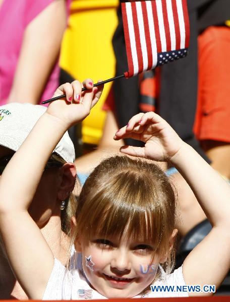 A little fan of the United States cheers for the team during the Group C first round match between the United States and the Democratic People's Republic of Korea (DPRK) at the 2011 FIFA Women's World Cup at the Rudolf-Harbig-Stadion in Dresden, Germany, June 28, 2011. (Xinhua/Ding Xu) 