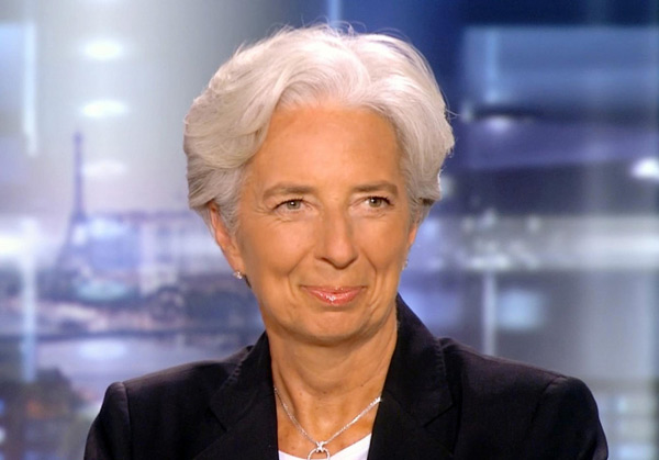 France's Finance Minister Christine Lagarde, seen in this video grab from private TF1 television prime time news, reacts after the announcement that she was selected as the new IMF chief, at the television studios in Boulogne-Billancourt, near Paris June 28, 2011. [China Daily]