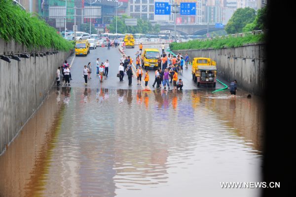 Water accumulated at a low-lying area as heavy rainfall hit Changsha, capital of central China&apos;s Hunan Province, June 28, 2011. The traffic was disturbed as downpour hit the city on Tuesday.