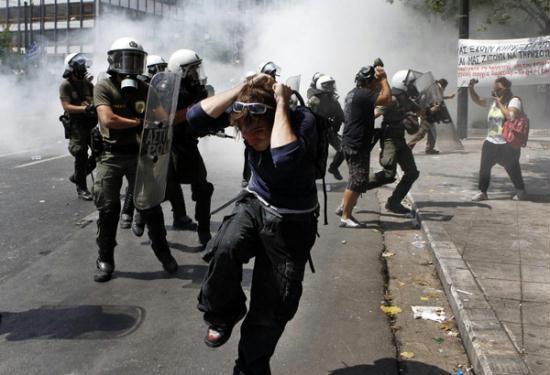 Riot policemen disperse protesters during violent protests against austerity measures in Athens' Syntagma (Constitution) square, June 28, 2011.