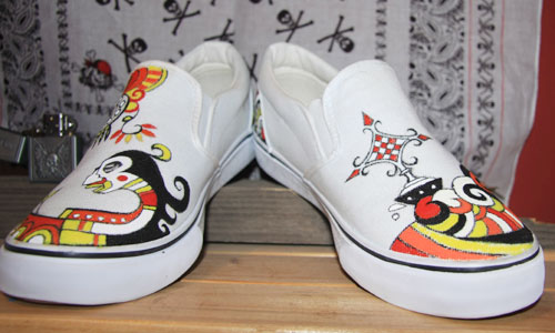 Hand-painted shoes with a Beijing opera mask design, made by Sun Peng, Owner of Alley Idea Space, a small shop located in Beiluoguxiang. 