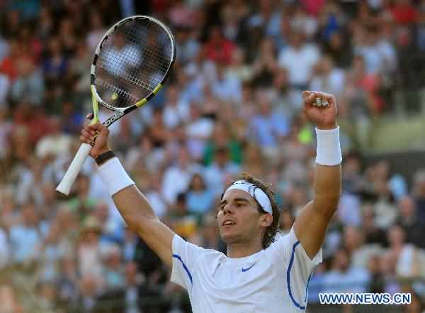 Rafael Nadal of Spain celebrates after winning his quarterfinal match against Mardy Fish of the United States in 2011's Wimbledon Championships in London, Britain, June 29, 2011. Nadal won 3-1 to enter the semifinals. (Xinhua/Zeng Yi) 